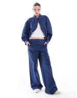 relaxed shirt and low rise trousers co-ord in blue stripe
