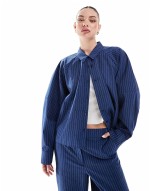 relaxed shirt and low rise trousers co-ord in blue stripe