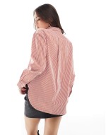 striped shirt wih logo in red and white